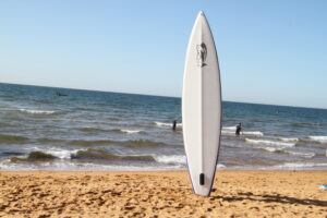 White V-Hull Inflatable SUP Paddleboard on Beach