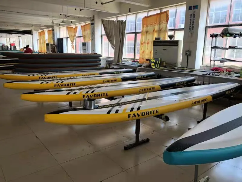 Inflatable SUP factory floor with multi-color paddle boards on display for wholesale buyers