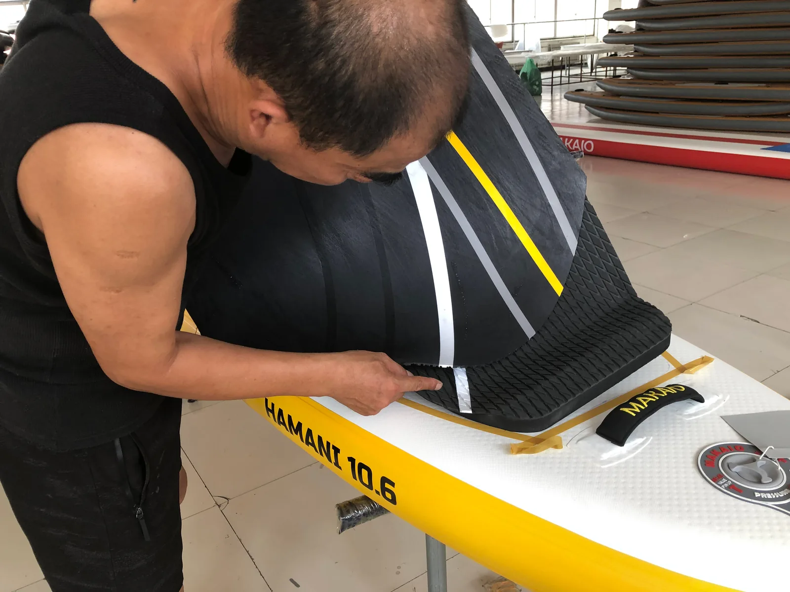 Factory quality inspection of private label inflatable SUP board edge before packaging